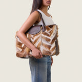 Model wearing the Alessia Large Tote in multicolor fox fur on the shoulder