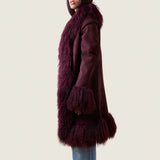 Side view of the Alexa burgundy shearling and Tibetan lamb coat