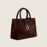 Bailey Mini Bag in cheetah print calf hair with gold front clip, three-quarter view