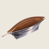 Blake Large Clutch in black and brown python-embossed leather unzipped to show the tan interior lining