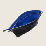 Blake Large Clutch in black ostrich unzipped to show the bright blue interior lining