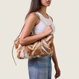 Model wearing the Blake Large Clutch in multicolor fox fur on the shoulder