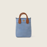 Front view of the Lola Mini Shopper in blue suede with cognac leather handles and gold star logo