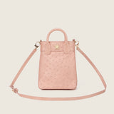 Lola Mini Shopper in champagne ostrich with its shoulder strap attached