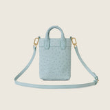 Lola Mini Shopper in light blue ostrich with its shoulder strap attached