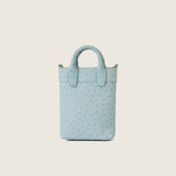 Back view of the Lola Mini Shopper in light blue ostrich with star logo