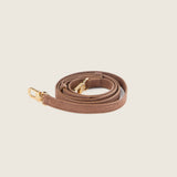 Tan leather shoulder strap with gold hardware for the Lola Mini Shopper