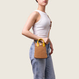 Model wearing the Lola Mini Shopper in tan suede crossbody