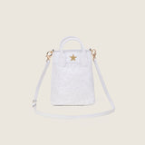 Lola Mini Shopper in white ostrich with its shoulder strap attached