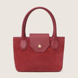 Front view of the Lucille Mini Tote in begonia suede with the flap closed