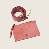Removable begonia suede cross-body pouch from the Lucille Mini Tote, shown with its strap