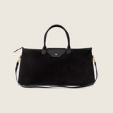 Maverick Weekender in black suede with its shoulder strap attached