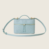 Mia Vanity Bag in light blue ostrich with its shoulder strap attached