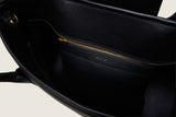 Interior of the Alessia Large Tote in black nappa leather with gold zipper detail