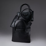 Alessia Large, Natalie Medium, and Lucille Mini Totes in black ostrich, stacked together