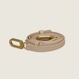 Tan leather shoulder strap with gold hardware for the Blake Large Clutch