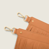 Close-up of the Fringe Shoulder Strap in tan nappa leather with gold clasps and star detail