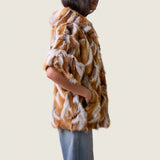 Side view of the Kate hooded jacket in multicolor fox fur