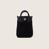 Front view of the Lola Mini Shopper in black suede with gold star logo