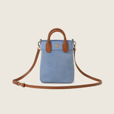 Lola Mini Shopper in blue suede with its shoulder strap attached
