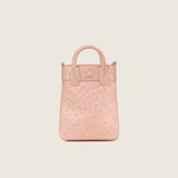 Front view of the Lola Mini Shopper in champagne ostrich with gold star logo