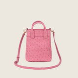 Lola Mini Shopper in pink ostrich with its shoulder strap attached