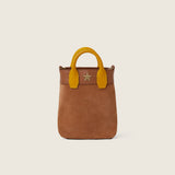 Front view of the Lola Mini Shopper in tan suede with mustard leather handles and gold star logo