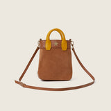 Lola Mini Shopper in tan suede with its shoulder strap attached