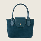Front view of the Lucille Mini Tote in bottle green suede with the flap closed