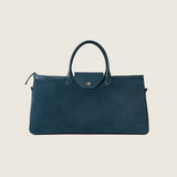 Front view of the Maverick Weekender in bottle green suede with gold star detail