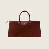 Front view of the Maverick Weekender in cognac suede with gold star detail