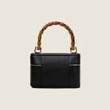 Back view of the Mia Vanity Bag in black nappa leather with bamboo handle