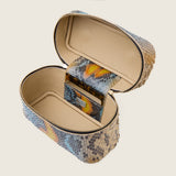 Mia Vanity Bag in desert sky python with the lid open to show the interior and mirror