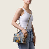 Model wearing the Mia Vanity Bag in desert sky python crossbody