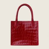 Front view of the Molly Mini Book Tote in cherry red alligator