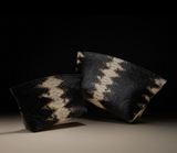 Taylor Mini Clutch in black and camel python-embossed leather shown with a matching larger clutch in soft dramatic light