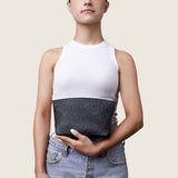 Model holding the Taylor Mini Clutch in black ostrich in front of her