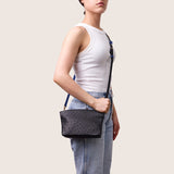 Model wearing the Taylor Mini Clutch in black ostrich crossbody
